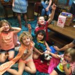 A group of kids wearing capes at Movie Night