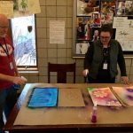 Holly and Kirk doing spray bottle painting in Art Therapy