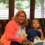 Katelyn and her Mom with snacks at movie night