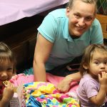 Girls eating popcorn at Movie Night