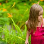 A girl walking in the Secret Garden